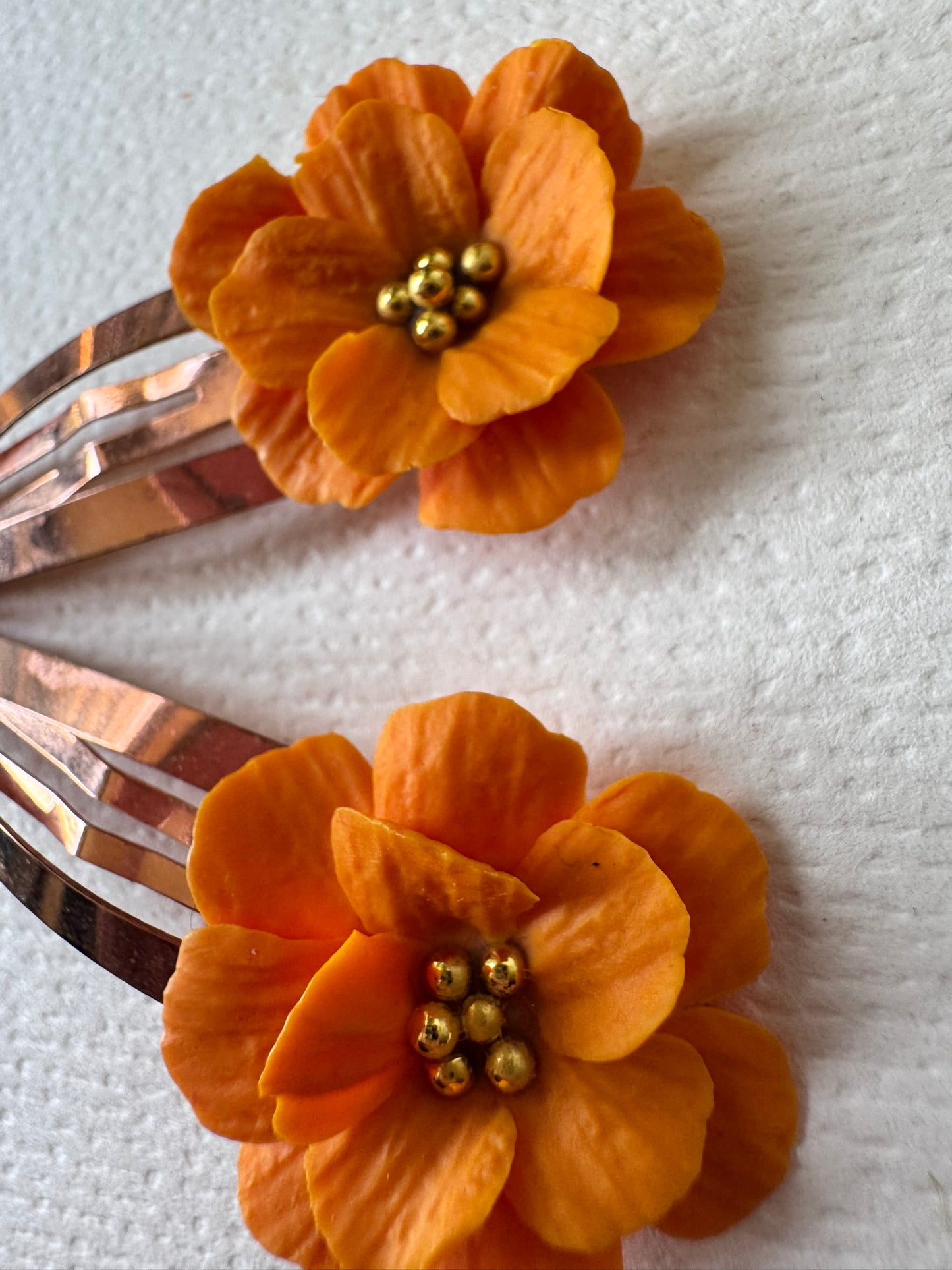 Orange flower hair clips