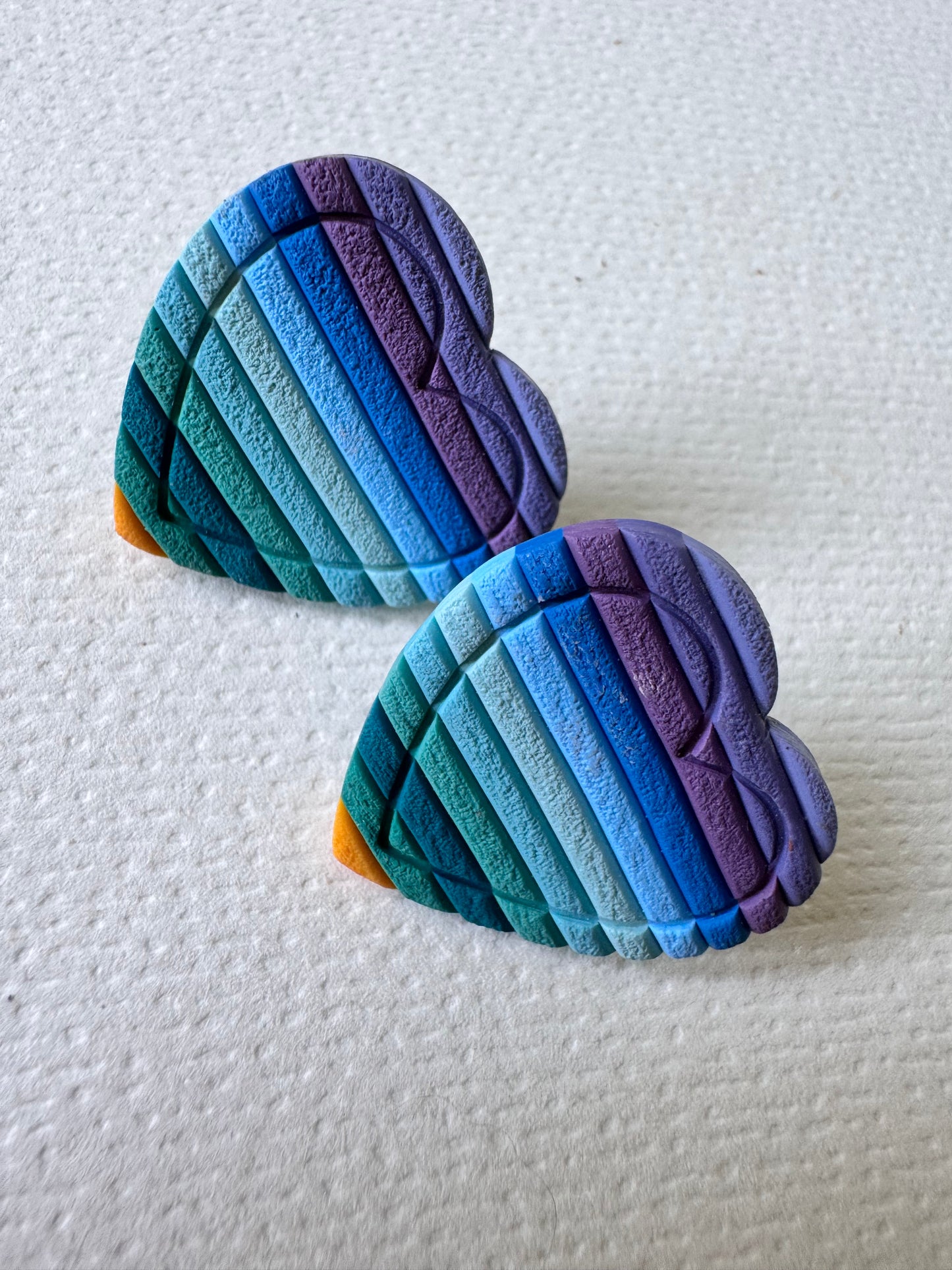 Textured blue rainbow heart studs