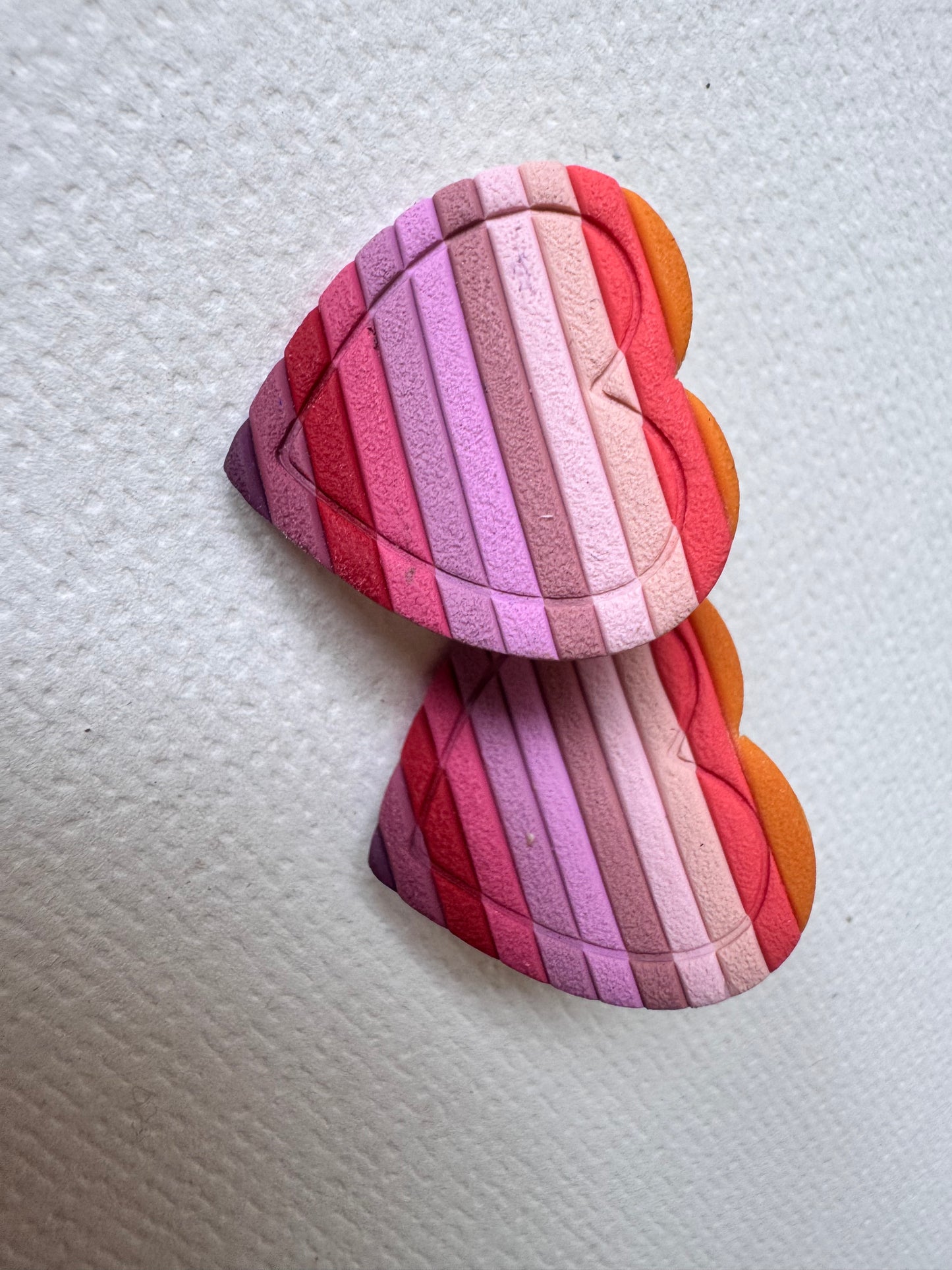 Textured red rainbow heart studs