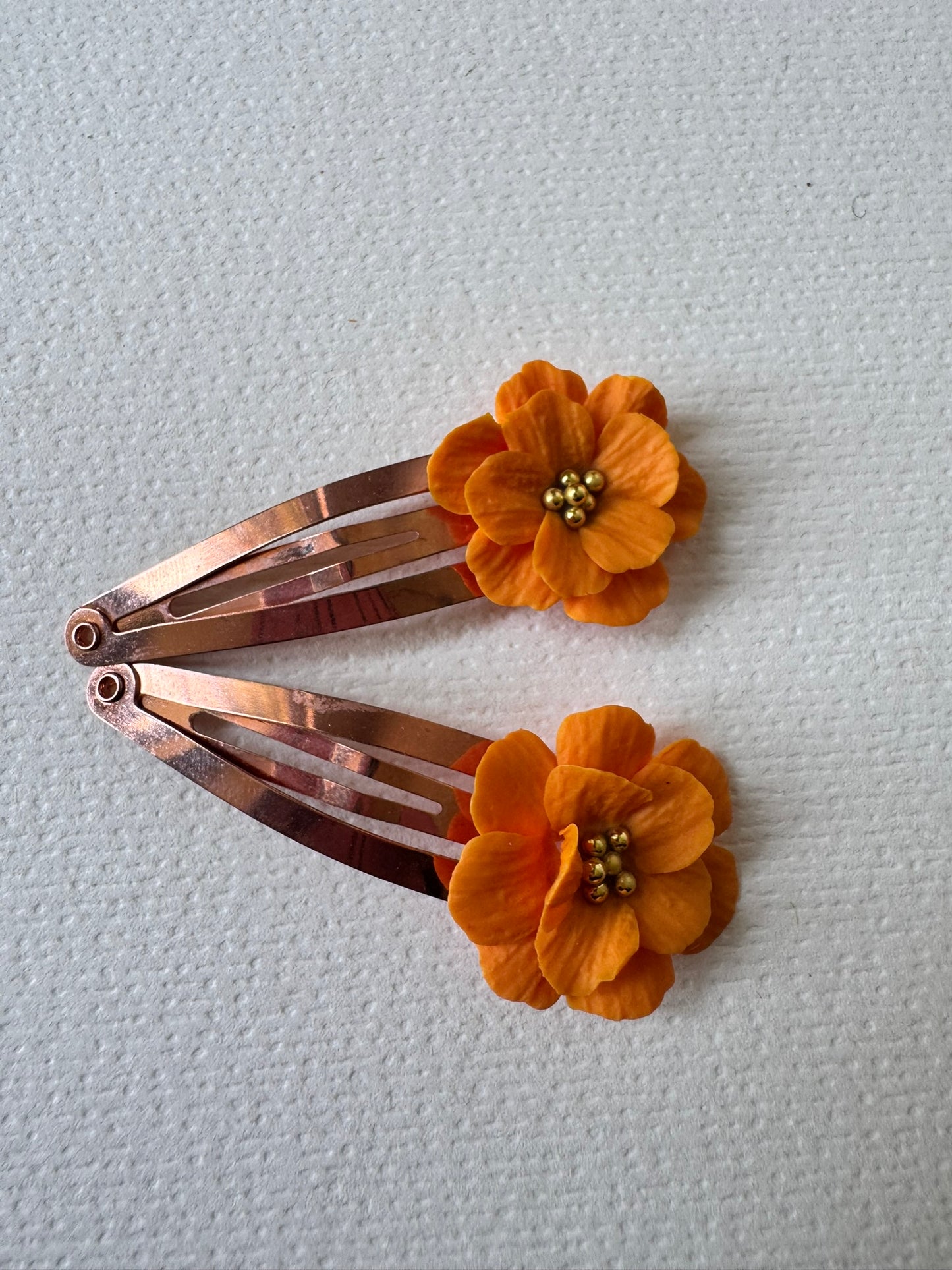 Orange flower hair clips