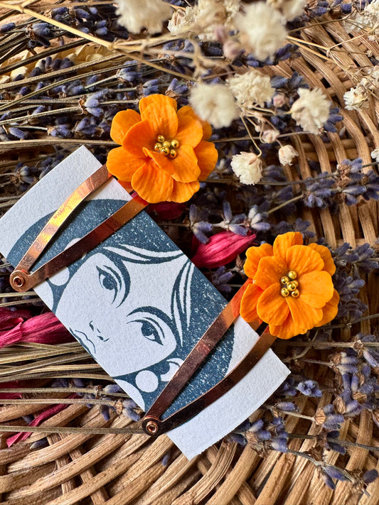 Orange flower hair clips