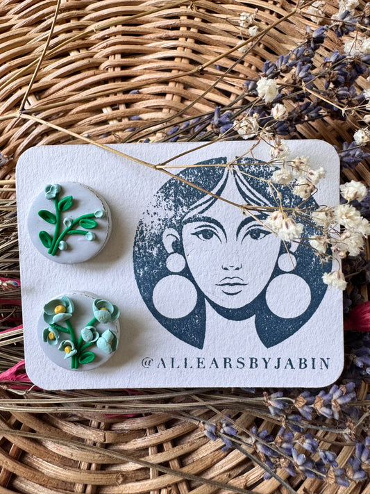 Blue botanical bloom studs