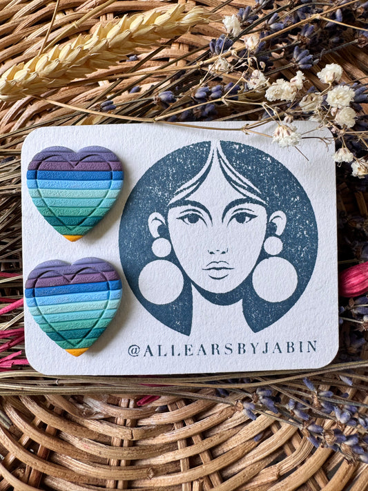 Textured blue rainbow heart studs