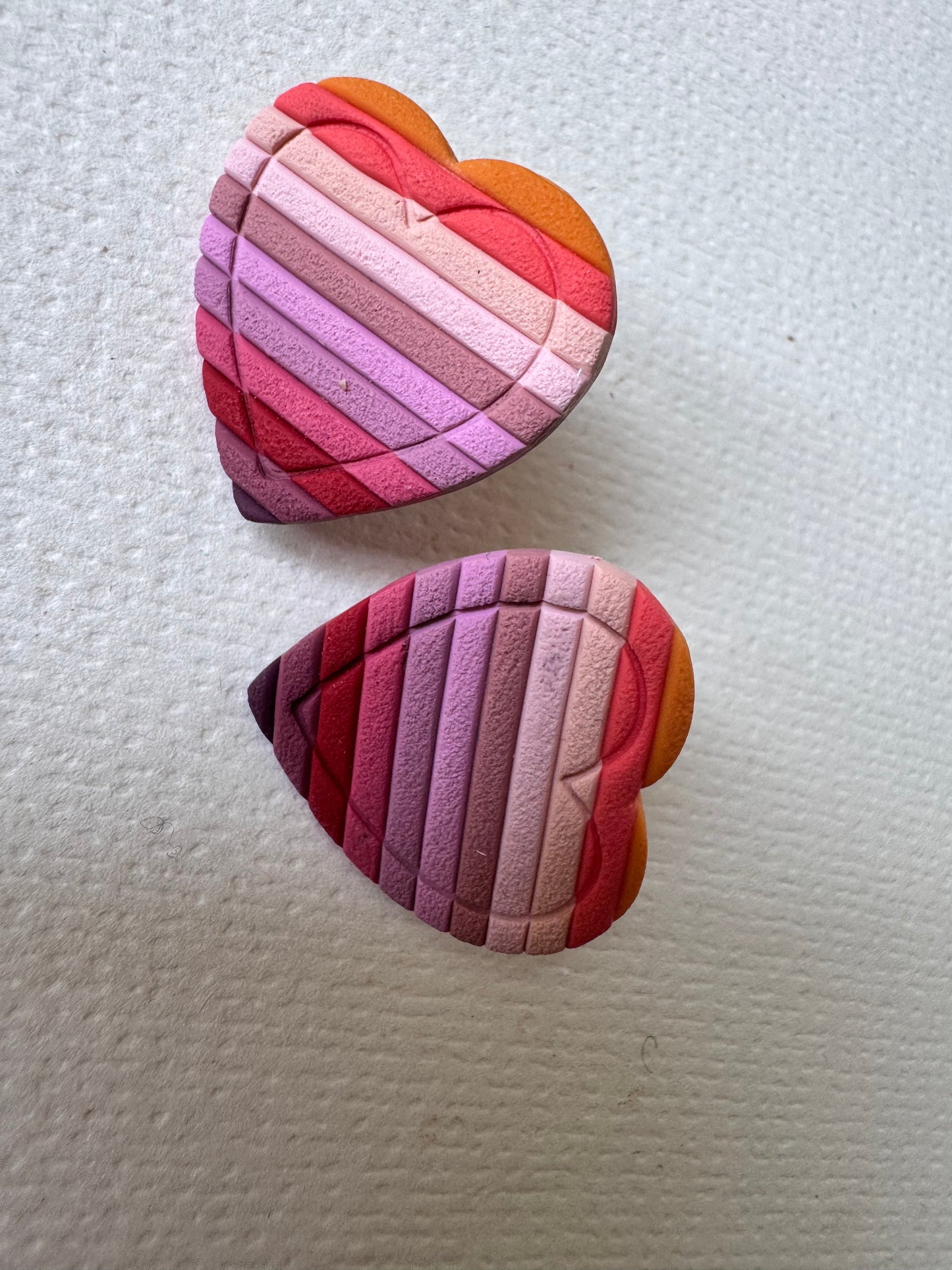 Textured red rainbow heart studs